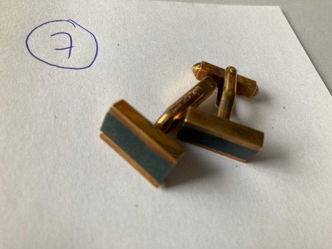 Manschettenknöpfe zu 7)