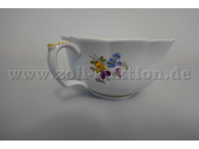eine Tasse mit Blumendekor
- Seitenansicht
