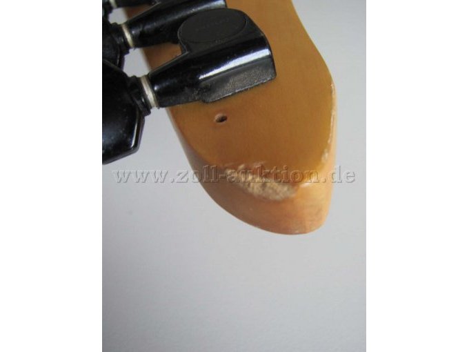Abplatzung Gitarrenkopf