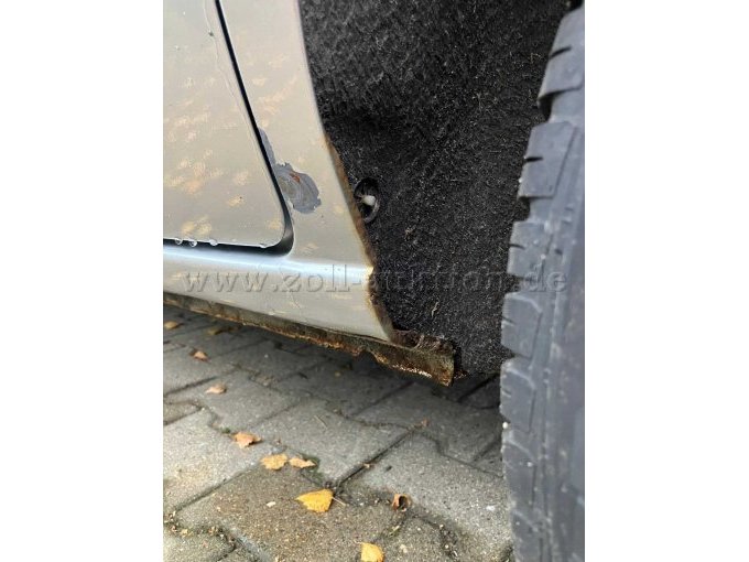Rost und Delle mit Lackschaden Radkasten hinten links