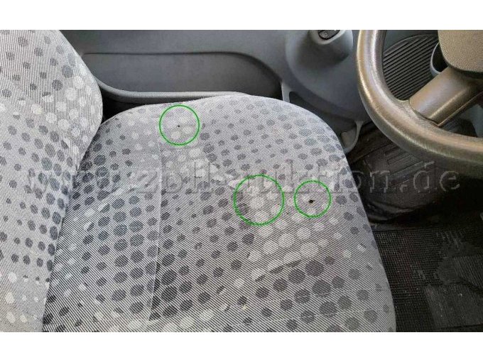 Fahrersitzbezug Brandlöcher