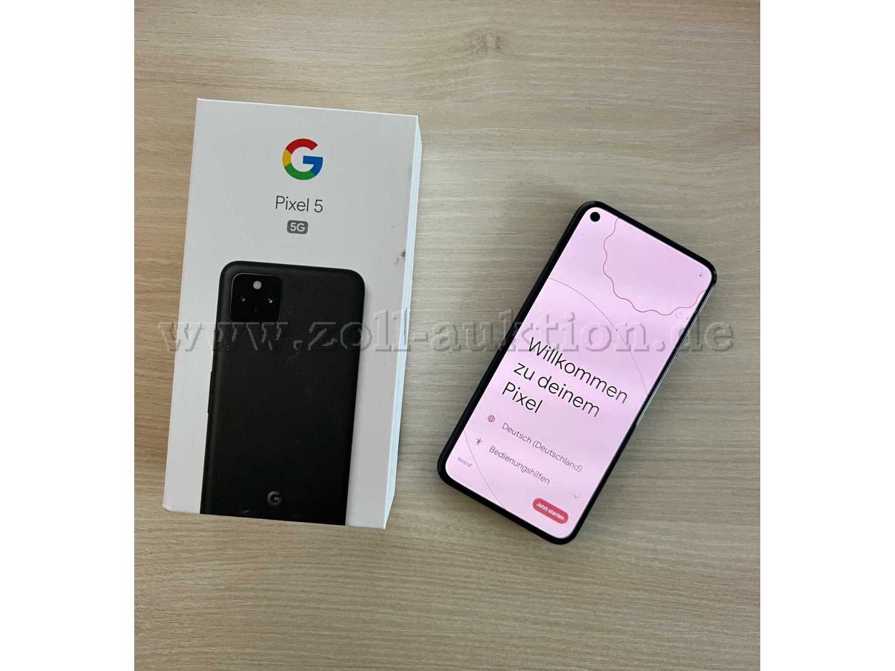 Draufsicht Verpackung und eingeschaltetes Smartphone