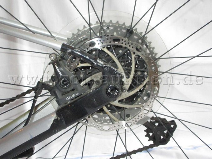 Teilansicht Hinterrad mit Scheibenbremse und Tektro Blemsblock, Kratzer und Schrammen