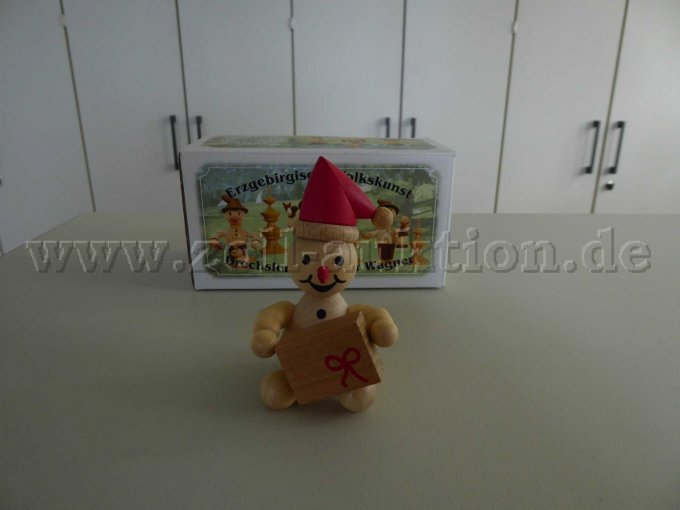Schneemann Junior "Weihnachtswichtel mit Geschenk / roter Mütze"