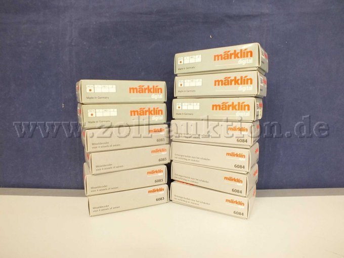 Gesamtaufnahme der Märklin 7x Nr. 6083 K83 decoder und 6x 6084 K84 decoder in OVP