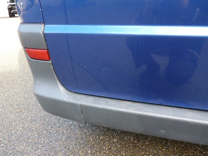 Schaden am Stoßfänger hinten links