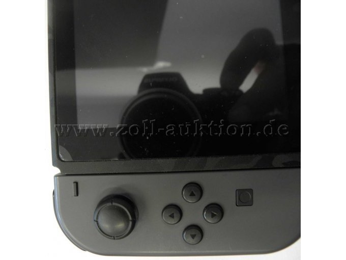 Nintendo Switch mit grauen Joy-Cons leichte Beschädigung Ecke Display