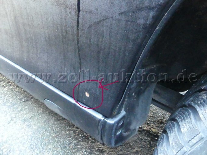 Lackabplatzung an der hinteren Tür Fahrerseite