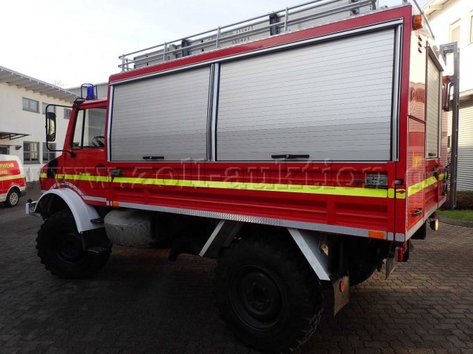 Rüst-, und Gerätewagen MB Unimog, Ansicht Fahrerseite von schräg hinten