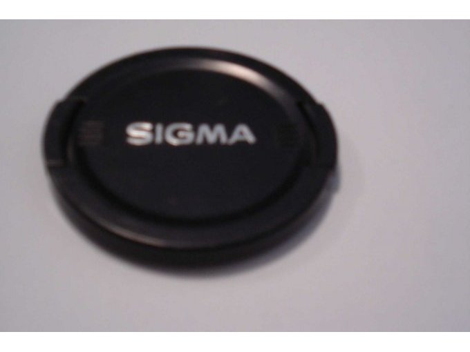 Die Abdeckkappe für das Objektiv.