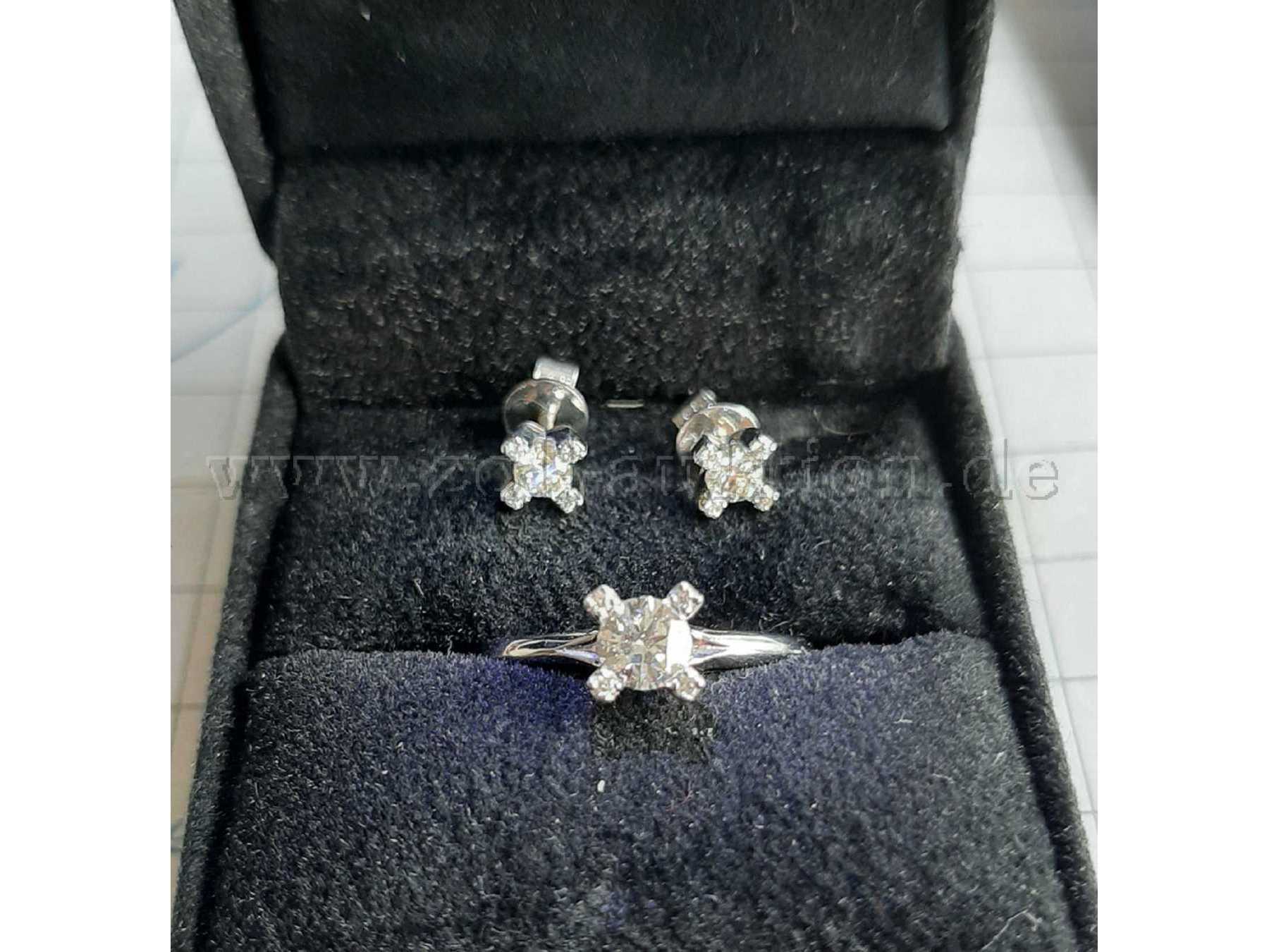 Weißgoldring und ein Paar Ohrstecker mit Brillanten