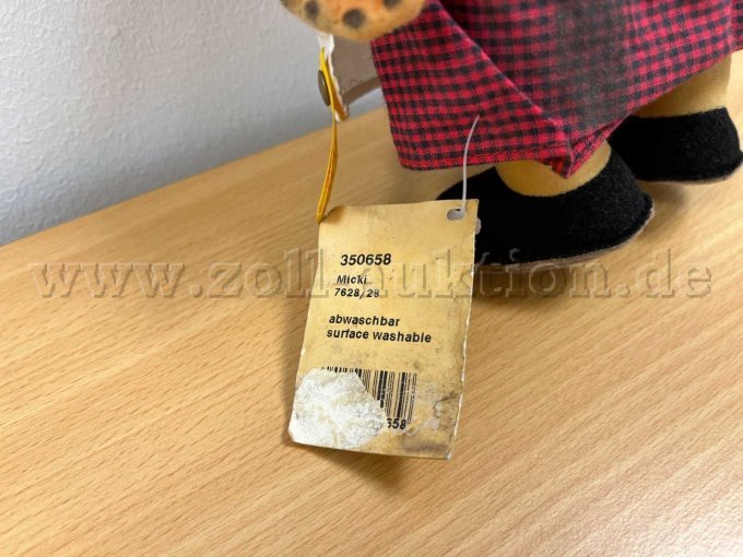 Stoff-Figur von Steiff "Micki", mit Knopf und Etikett.