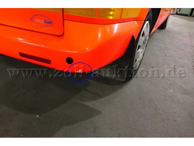 Lackschaden an dem Heckstoßfänger rechts