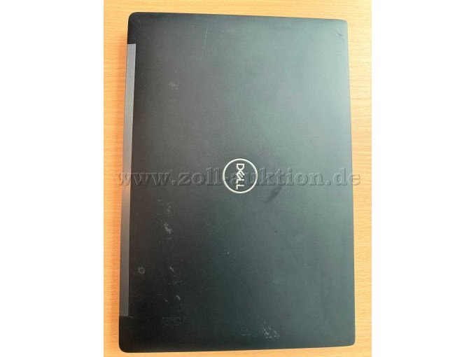 Abschürfungen der Beschichtung am Deckel und eine kleine Delle